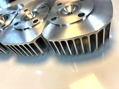 Kawasaki H1 500SS Mach III billet cylinder head — polished aluminum, high-efficiency combustion chamber
